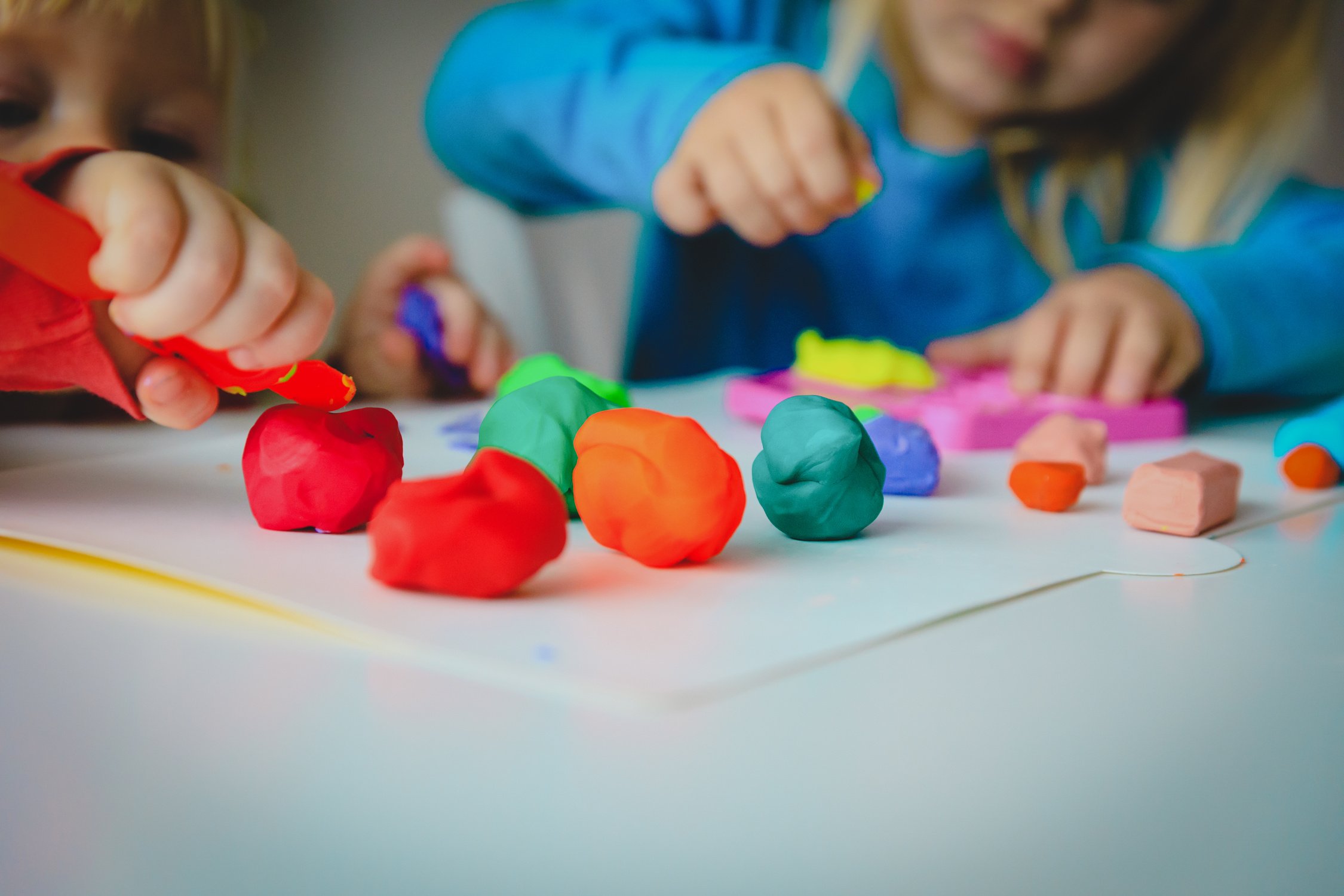 kids play with clay molding shapes, learning through play